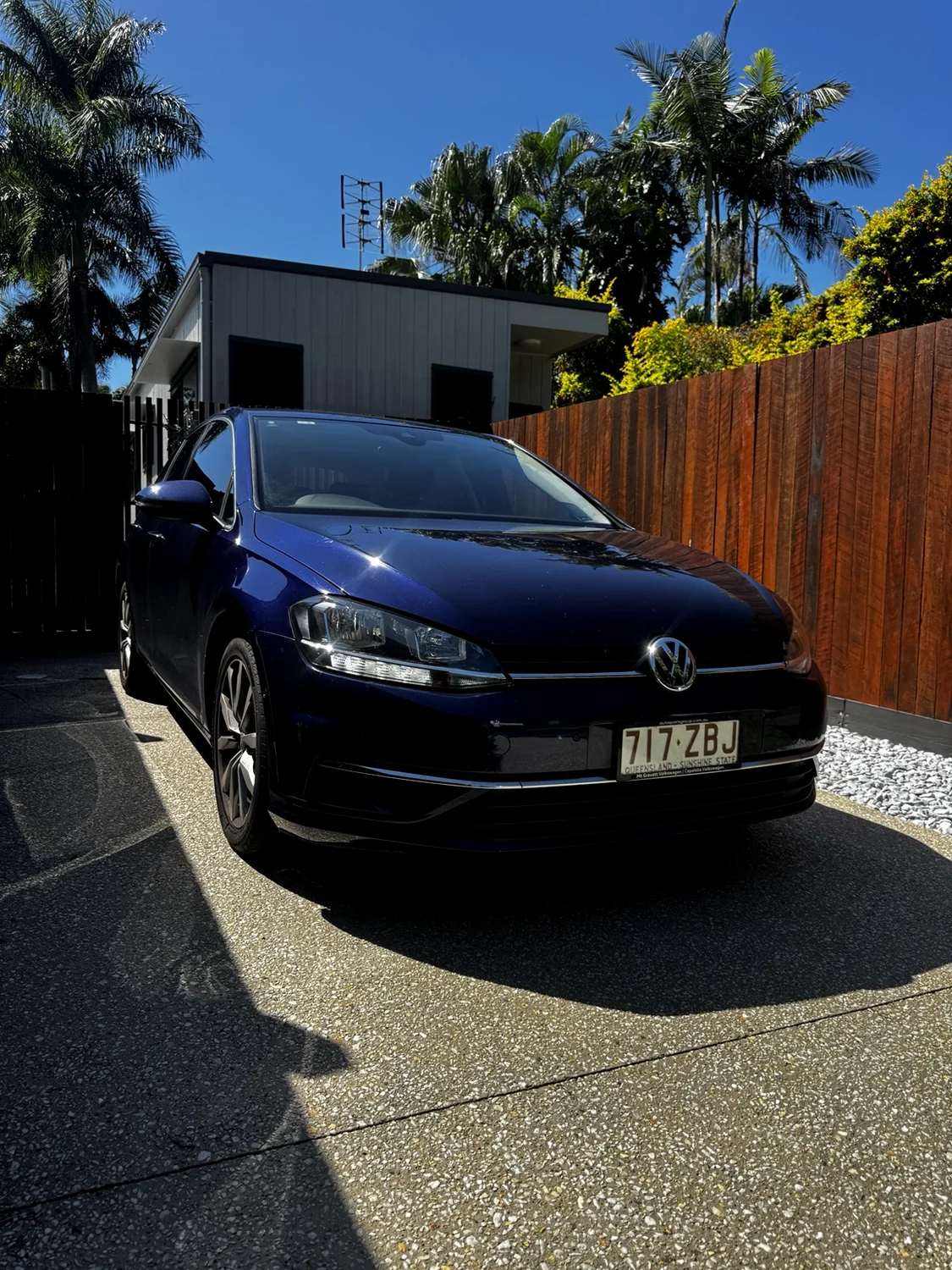 Actual Sunroad blue Golf parked outside on the Sunshine Coast